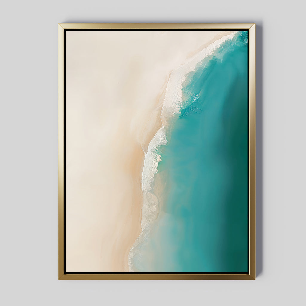 The Beach Abstract Canvas Art features a framed aerial shoreline photo with white sand and turquoise water, set in a gold frame with black edging for serene elegance on your light gray living room wall.