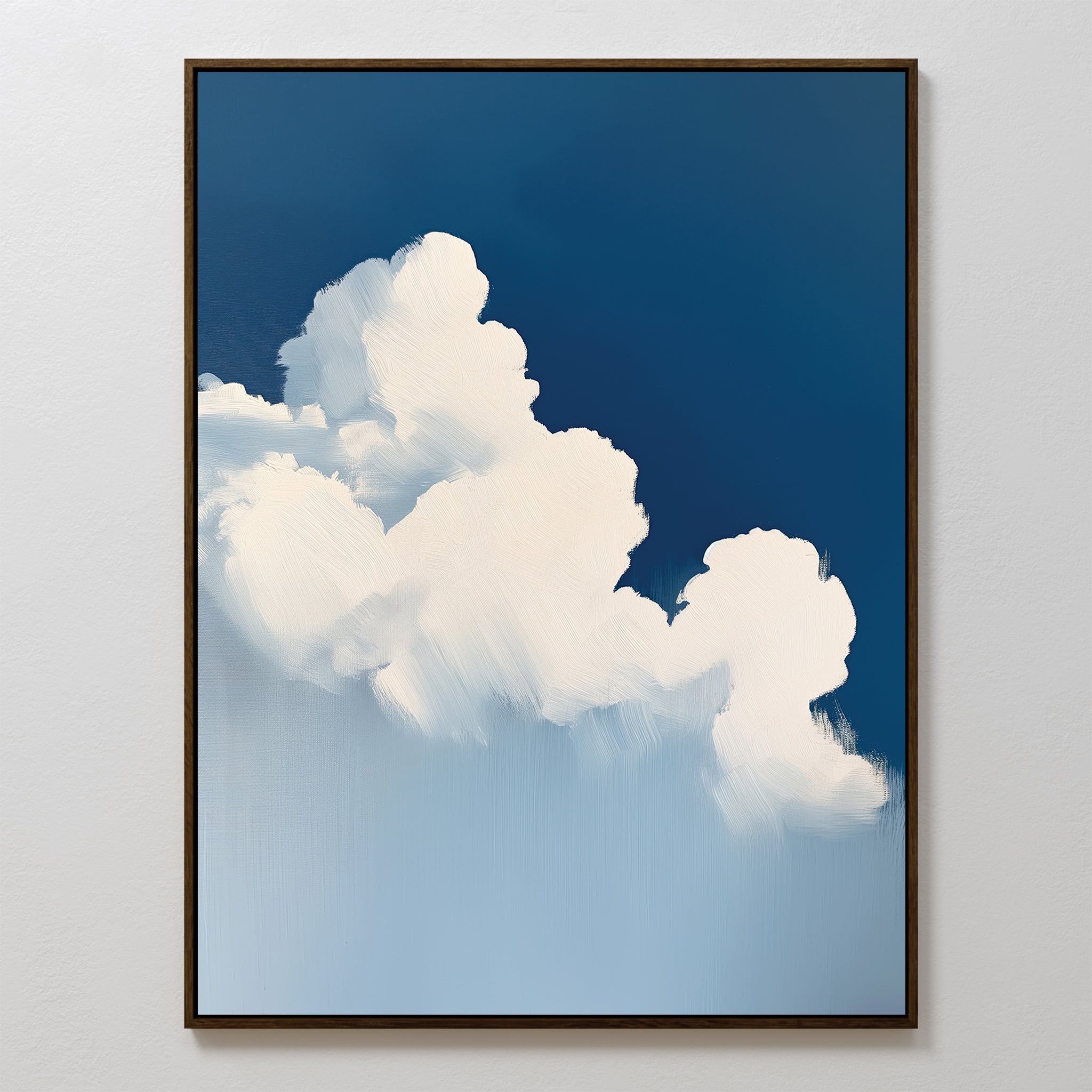 The Cumulus Abstract Canvas Art is a minimalist wall piece featuring fluffy white clouds against a deep blue sky, soft brushstrokes for a serene feel, and a thin dark frame that contrasts beautifully with the calming artwork.