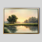 The Journey Canvas Art is a framed painting of a peaceful countryside sunrise, with a calm river, lush trees, and tall grass in misty sunlight—perfect rustic wall art for adding serene decor to your space.