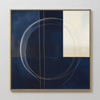 The Orbit Canvas Art showcases a navy blue and cream color block design with thin, overlapping white circular and straight lines, all in a light wood frame—perfect for adding minimalist style to modern home decor.