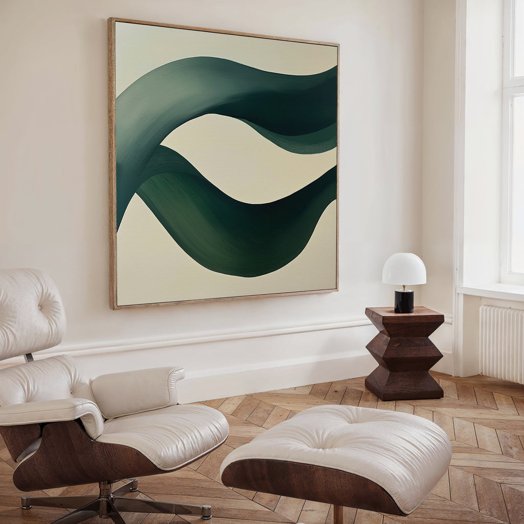 A modern living room with a white lounge chair and ottoman, a small wooden side table with a white lamp, and the Tidal Grace Canvas Art adding fluid abstract style to the space.