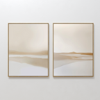 The Tranquil Horizons Set of 2 features minimalist framed abstract landscapes in soft beige, tan, and white tones, adding serene simplicity when displayed side by side on a white wall.