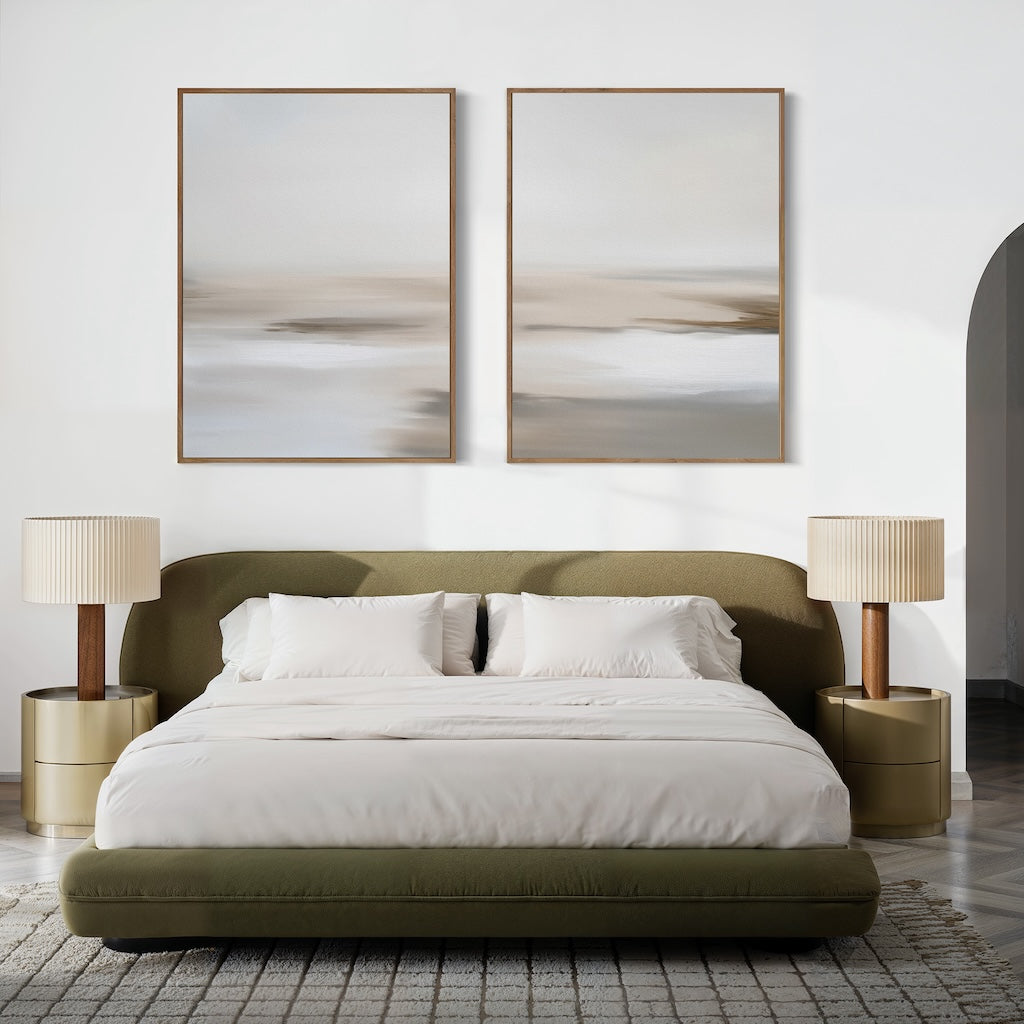 A modern bedroom with a low olive-green bed, white bedding, beige nightstands, and the Tranquil Shifts Set of 2 wall art above the bed. Neutral tones and a patterned rug complete the sleek, minimalist look.