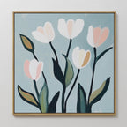 Tulip Harmony Canvas Art features five abstract tulips with white and pink petals on a light blue background in a slim gold frame—ideal minimalist wall art for bedroom or living room decor.