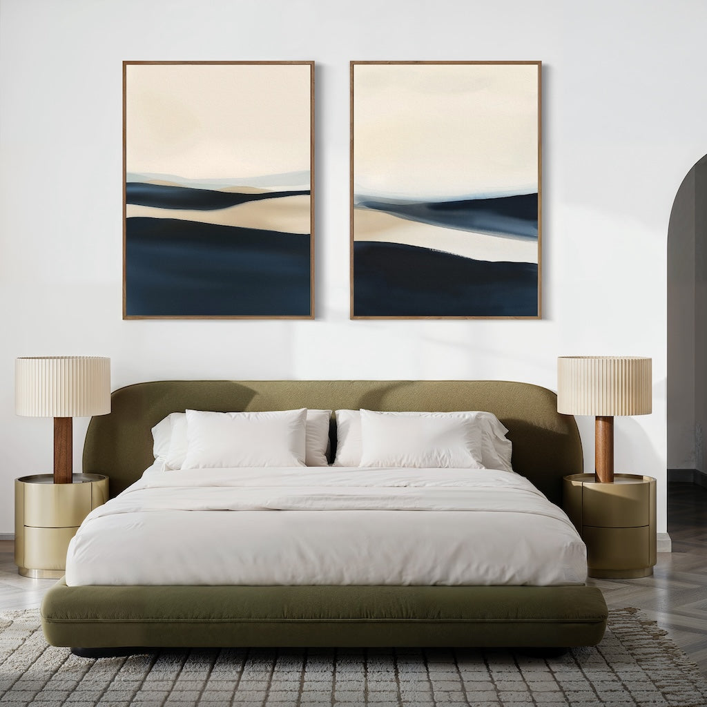 A modern bedroom features a green upholstered bed with white bedding, two beige nightstands with matching lamps, and the Twilight Horizons Set of 2 abstract paintings above the bed on a crisp white wall for an inviting touch.