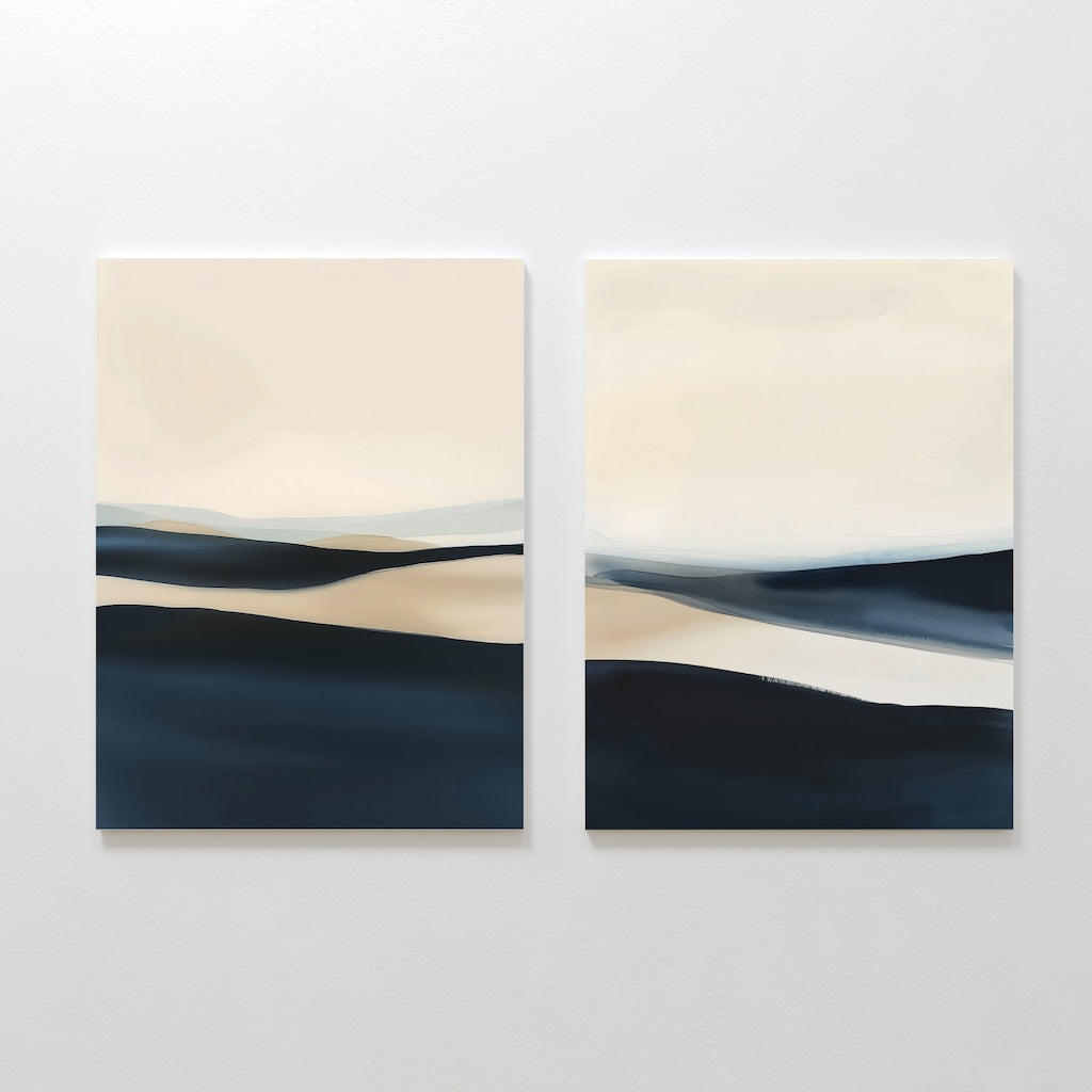 The Twilight Horizons Set of 2 features abstract canvas paintings with soft, layered waves of cream, beige, and deep blue. These minimalist artworks create a serene focal point—ideal for modern decor.