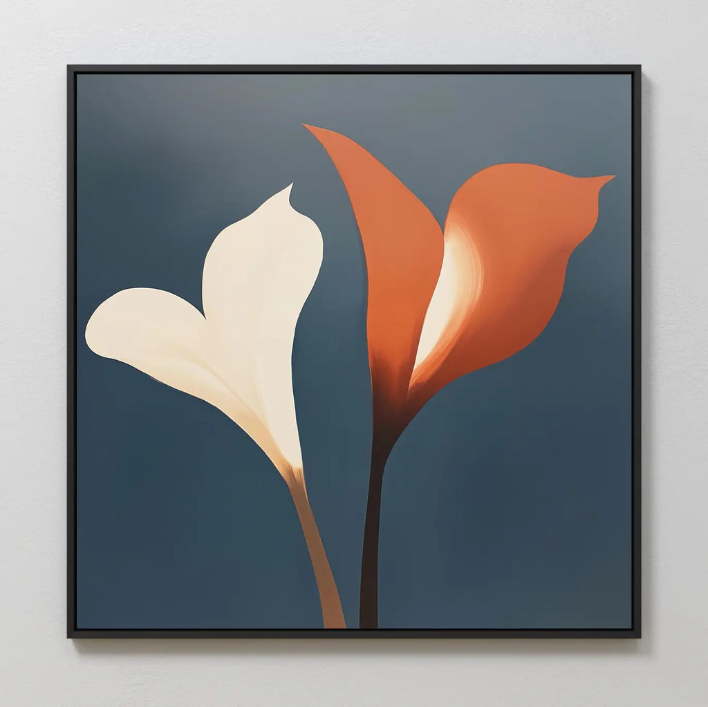 The Twin Blooms Canvas Art showcases a minimalist botanical print of white and orange calla lilies with brown stems on a dark blue background, framed by a thin black border—ideal for Nordic Park-inspired wall décor.