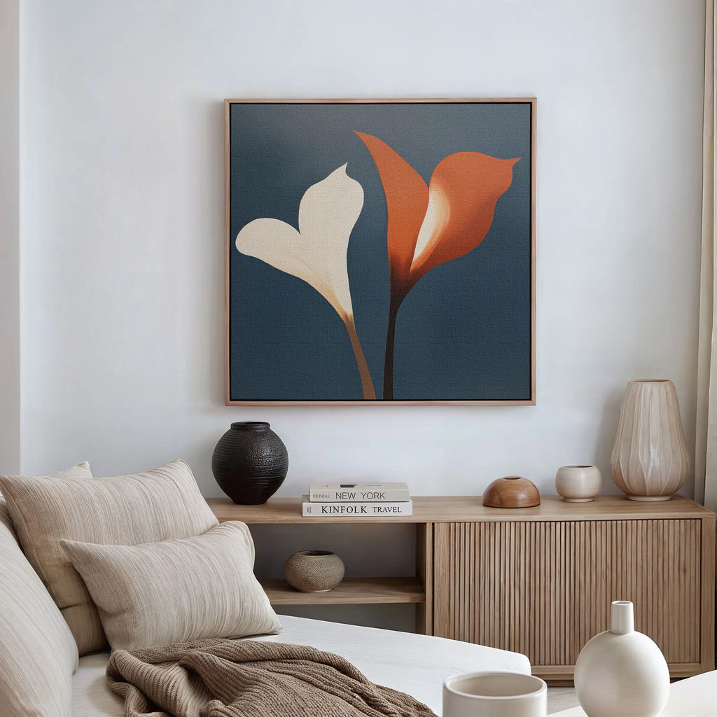 A modern living room with a beige sofa, neutral cushions, a wooden sideboard, and striking wall art—a framed Twin Blooms Canvas Art featuring abstract calla lilies on blue—brings Nordic Park style to life.