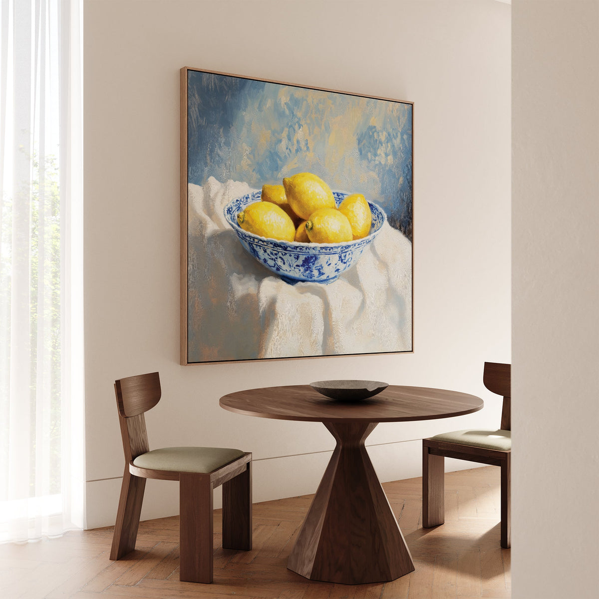 A dining nook with a round wooden table, two chairs, and the Golden Fruit Canvas Art above, bathed in natural light from a window with sheer curtains—a charming spot for vintage home decor lovers.