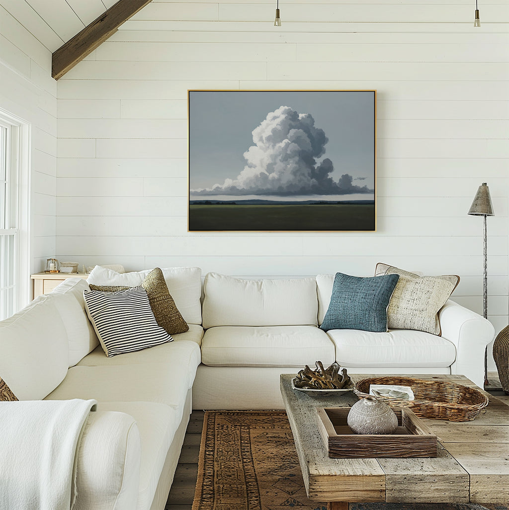 Bright living room with white shiplap walls, a large white sectional sofa with assorted pillows, rustic wood coffee table, woven baskets, and the Uplifted Sky Canvas Art featuring a cloud formation above the couch.