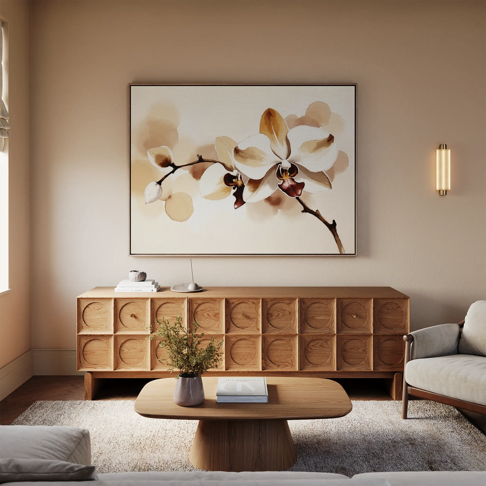 A modern living room in neutral tones features the elegant Vanilla Bloom Canvas Art—a large white orchid print—above a wooden sideboard, plus a round coffee table with flowers, a light sofa, and warm lighting for a cozy feel.
