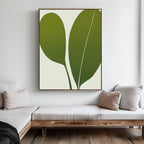 The Verdant Duo Abstract Canvas Art features two large, overlapping green leaves, offering modern wall art with a clean, neutral style—perfect for elevating your living room decor above a bench or sofa.
