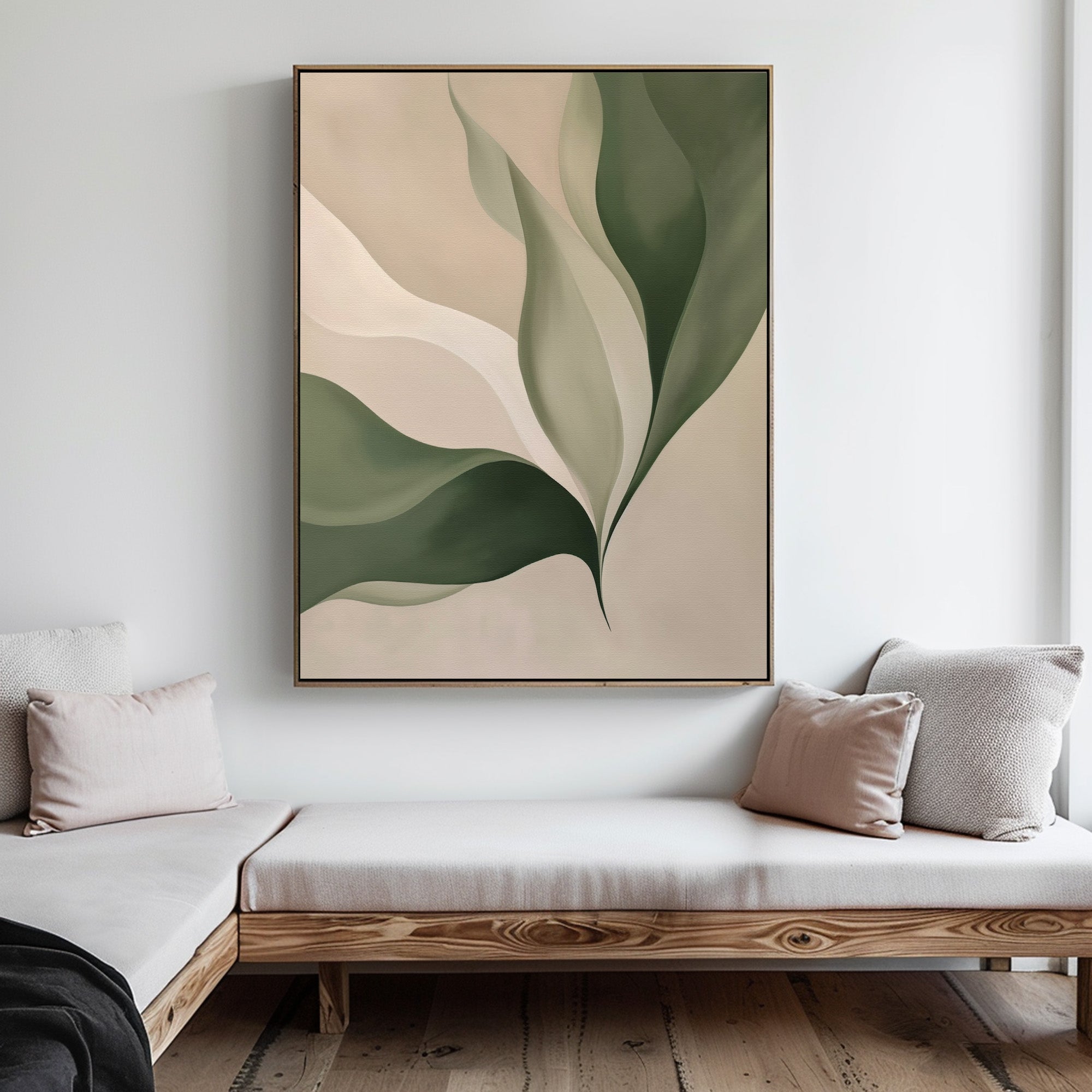 A modern living room with light wood benches, neutral cushions, and minimalist decor showcases Verdant Grace—a large abstract wall art piece of overlapping green and beige leaf shapes—as stylish living room decor.
