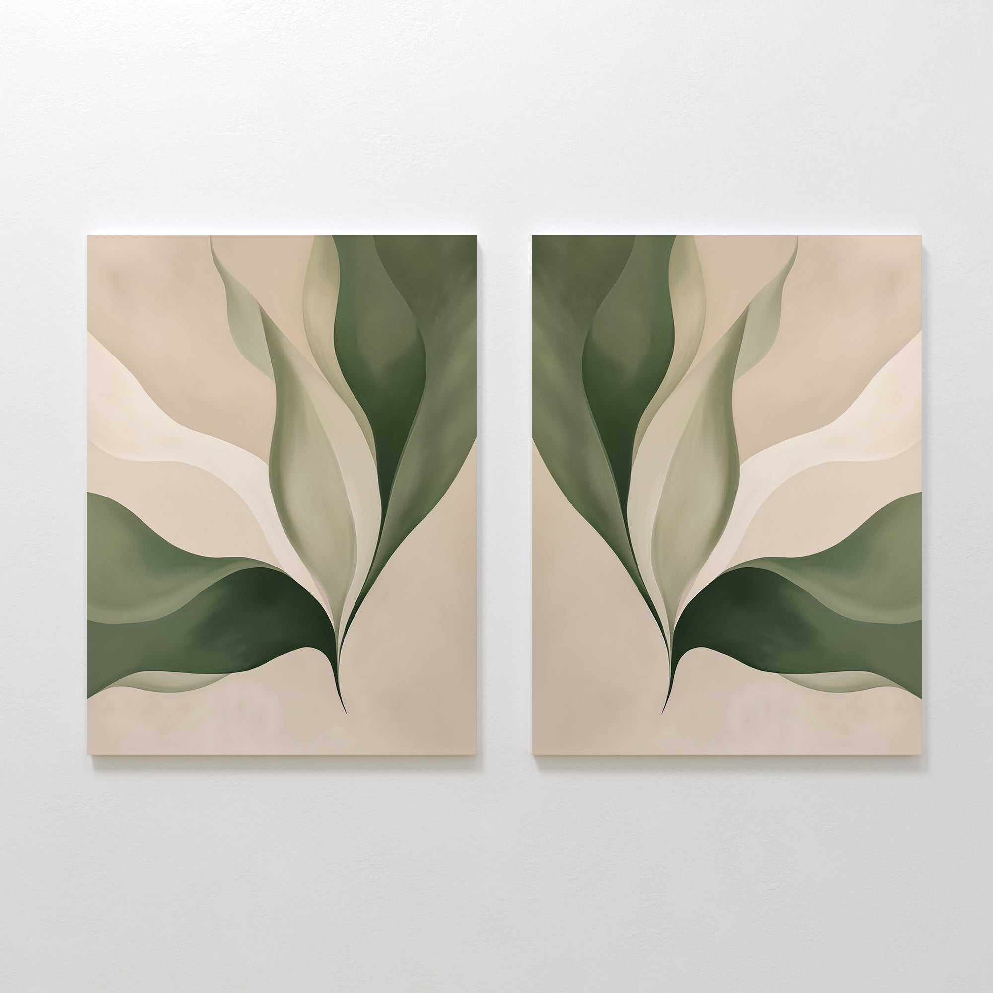The Verdant Grace Set of 2 features minimalist wall art with soft, overlapping green and beige leaf shapes on a neutral background. Mirrored abstract designs create a harmonious look, ideal for enhancing your living room decor.