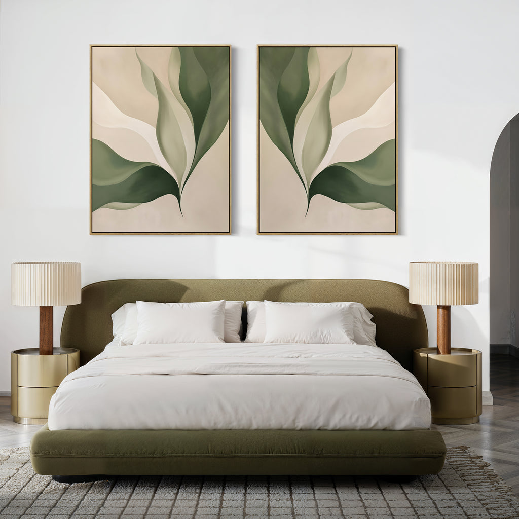 A modern bedroom features an olive green bed, white bedding, two round nightstands with beige lamps, and the Verdant Grace Set of 2—minimalist wall art with abstract green leaves—displayed above the bed.