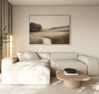 A minimalist living room with a light beige sectional sofa, wooden coffee table, Vintage Horizon Canvas Art – Horizontal on the wall, and a plant in the corner, all in soft neutral tones.