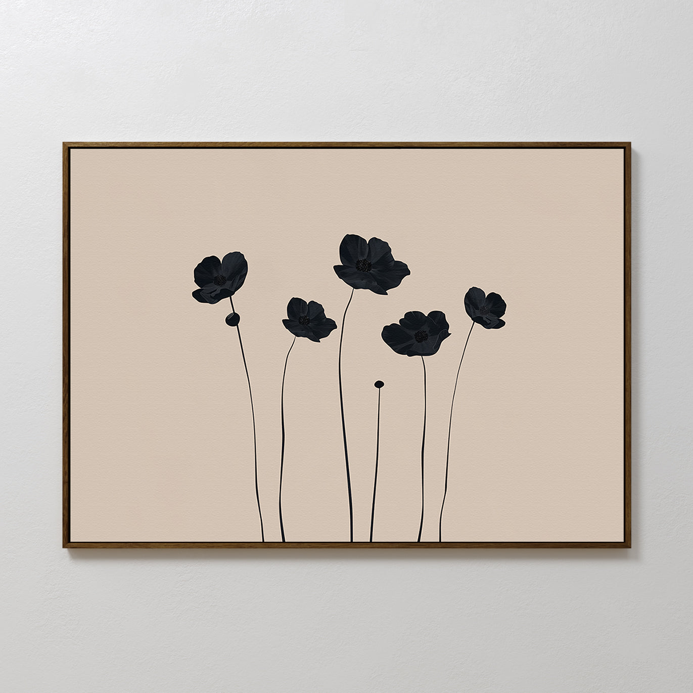 Botanic Abstract Canvas Art showcases six black floral silhouettes with long stems on a beige background, set in a simple brown frame and displayed on a white wall for a modern, minimalist touch.