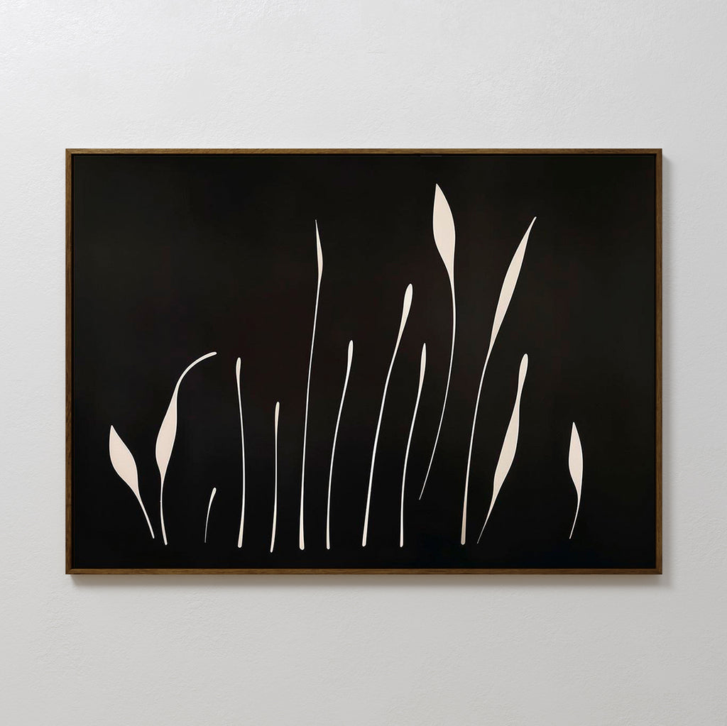 Botanical Silhouettes Abstract Canvas Art showcases elongated white floral silhouettes on a solid black background, resembling tall grass or stems, and is framed with a thin brown border.