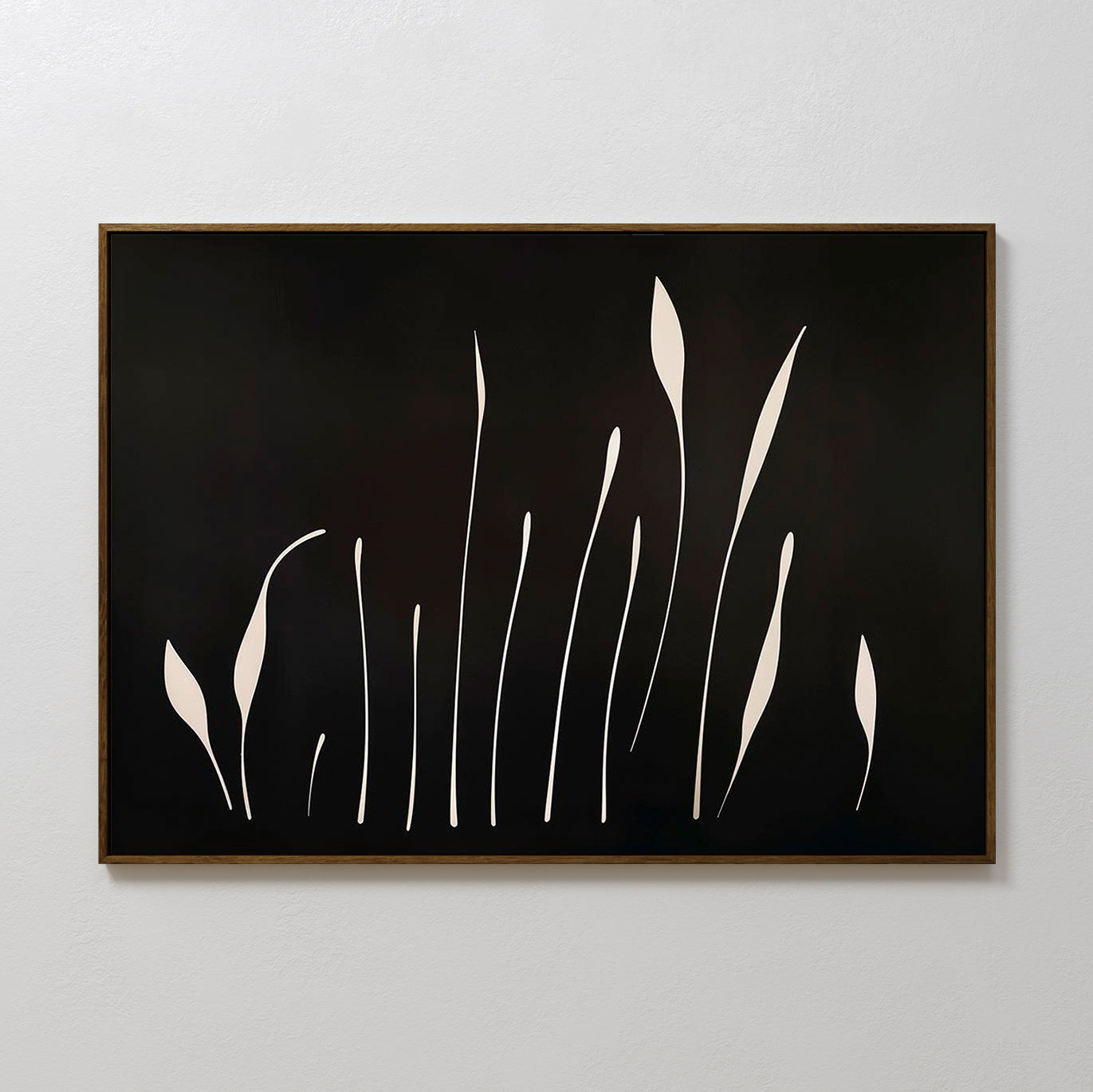 Botanical Silhouettes Abstract Canvas Art showcases elongated white floral silhouettes on a solid black background, resembling tall grass or stems, and is framed with a thin brown border.
