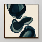 Deep Sea Hues Abstract Canvas Art showcases two large, dark blue and gray organic shapes flowing on a light beige background. This minimalist piece is perfect for elegant living room decor, evoking the essence of fluid waves.