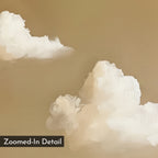 Zoomed-in detail of white, fluffy clouds with visible brushstrokes on a warm beige background. "Whispering Clouds" minimalist wall art features a black label in the bottom left corner that reads Zoomed-In Detail.
