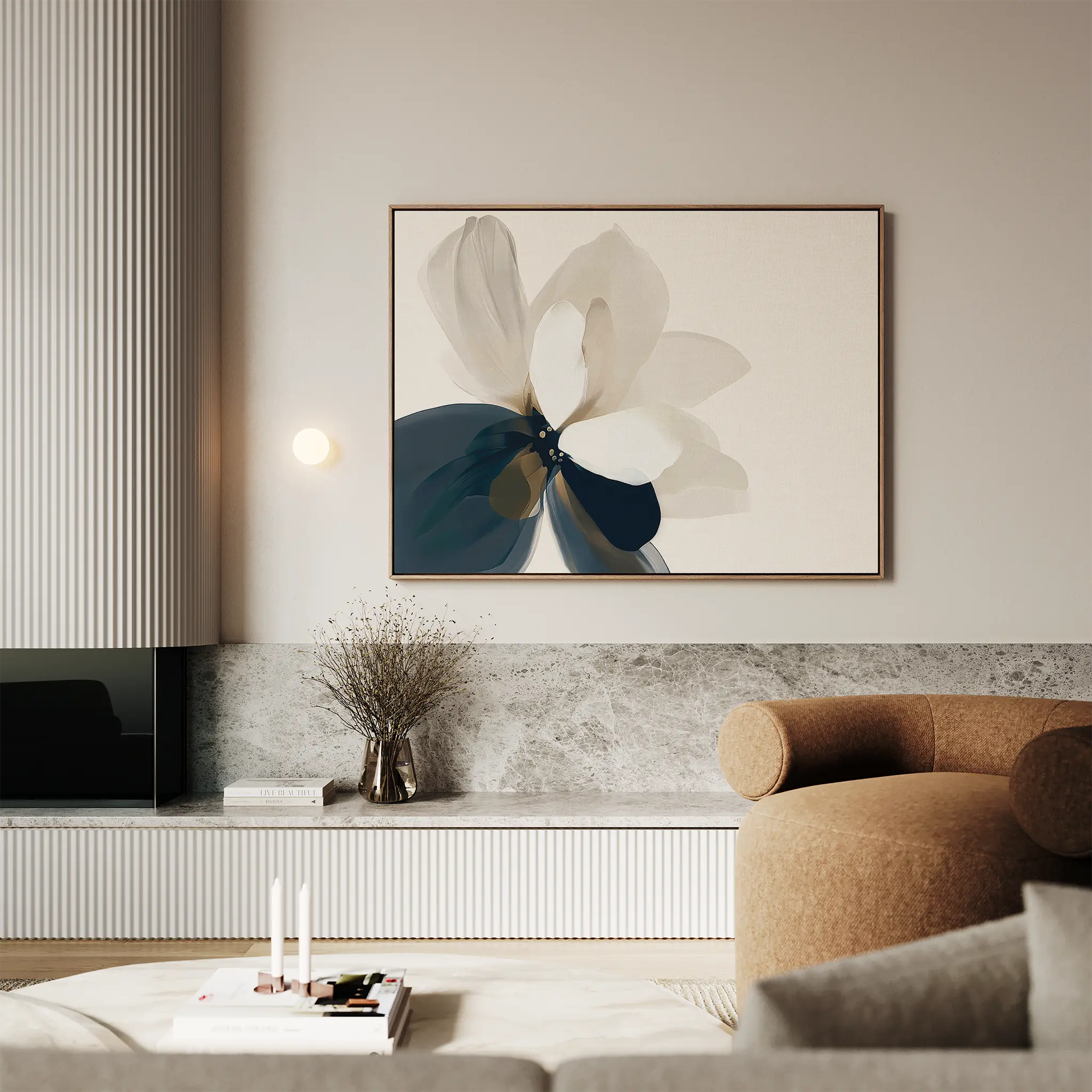 A modern living room with neutral tones features the Whispering Petals Canvas Art - Horizontal, a large abstract flower painting, paired with a round tan armchair, minimalist decor, and a marble surface topped with a vase of dried flowers.