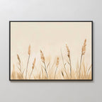 Whispering Reeds Canvas Art features beige and brown wheat stalks on a cream background, framed in sleek black. This modern wall art brings a calm, natural vibe—perfect for understated living room decor.