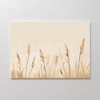 Whispering Reeds Canvas Art showcases tall beige and brown grasses on a light, neutral background. This modern piece uses soft, muted tones to add a serene, natural touch to your living room decor.