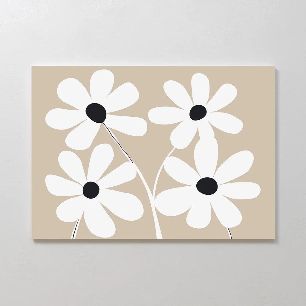 White Blooms Canvas Art features four minimalist white flowers with black centers and thin stems on a beige background, perfect for displaying on a white wall.