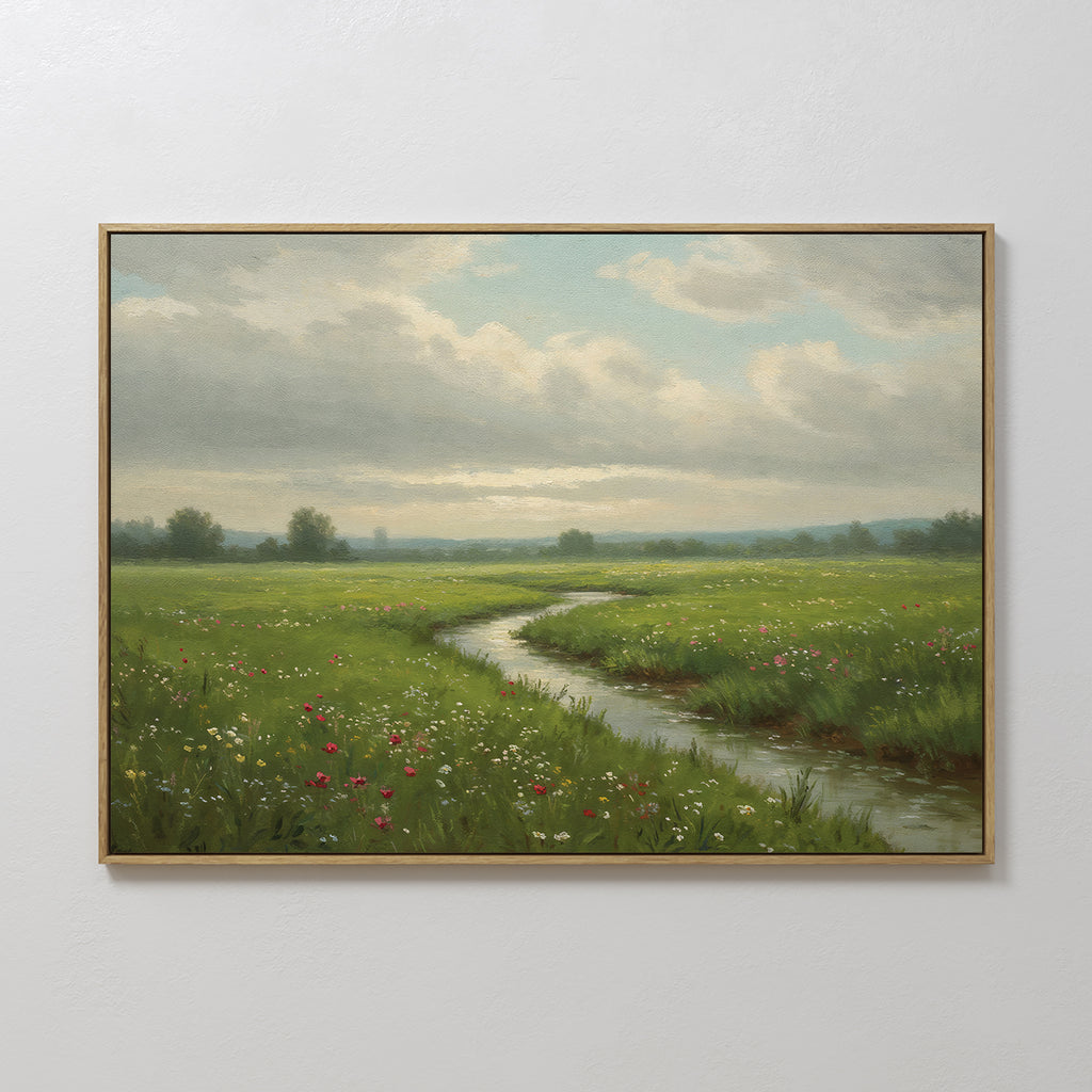 The Winding Stream Canvas Art features a minimalist green landscape of a grassy meadow with wildflowers and a winding stream beneath a cloudy sky, perfect as framed wall decor for any space.