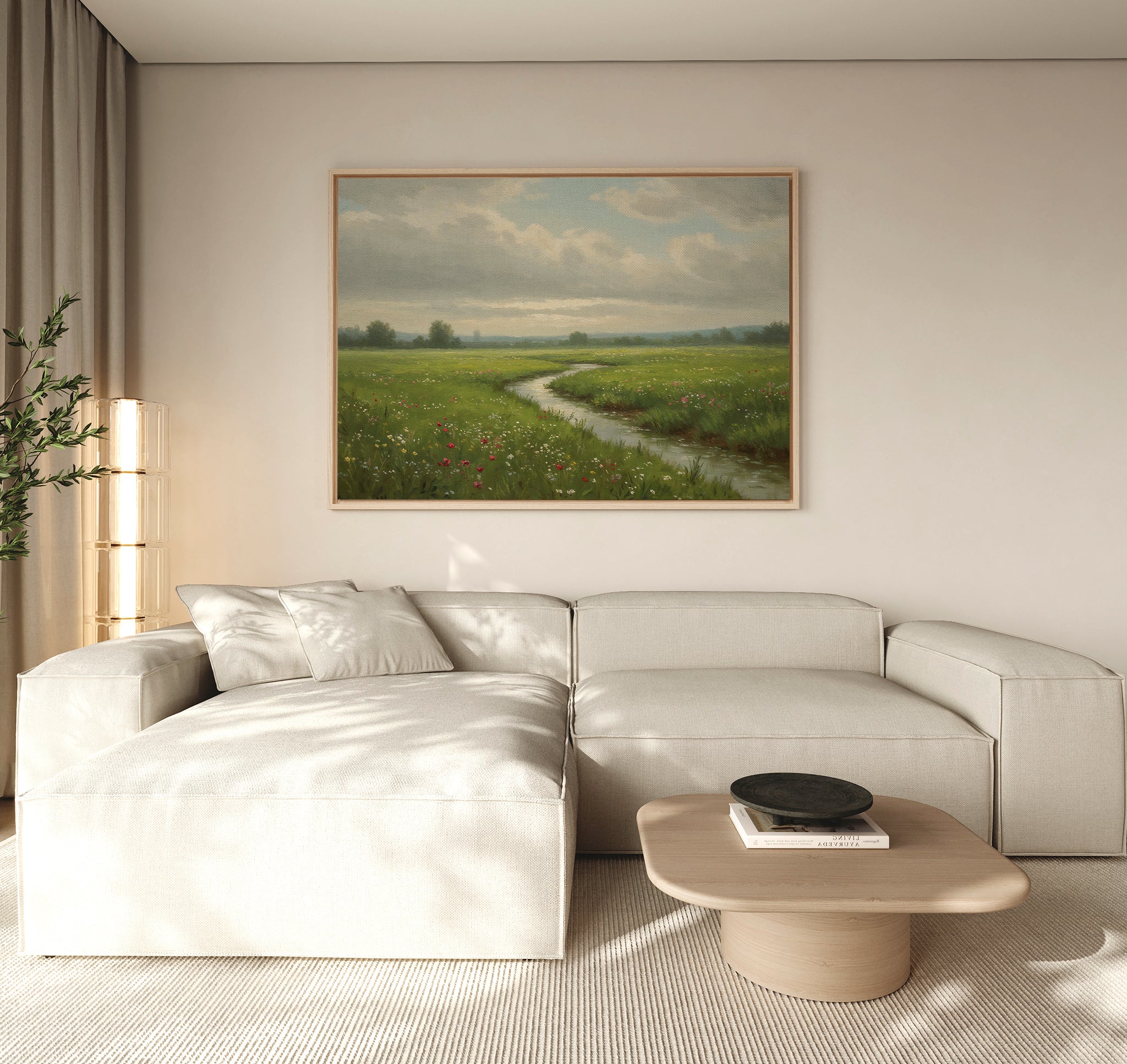 A modern living room with a light beige sectional sofa, a wooden coffee table topped with a black bowl, and the Winding Stream Canvas Art as striking wall decor above the sofa.