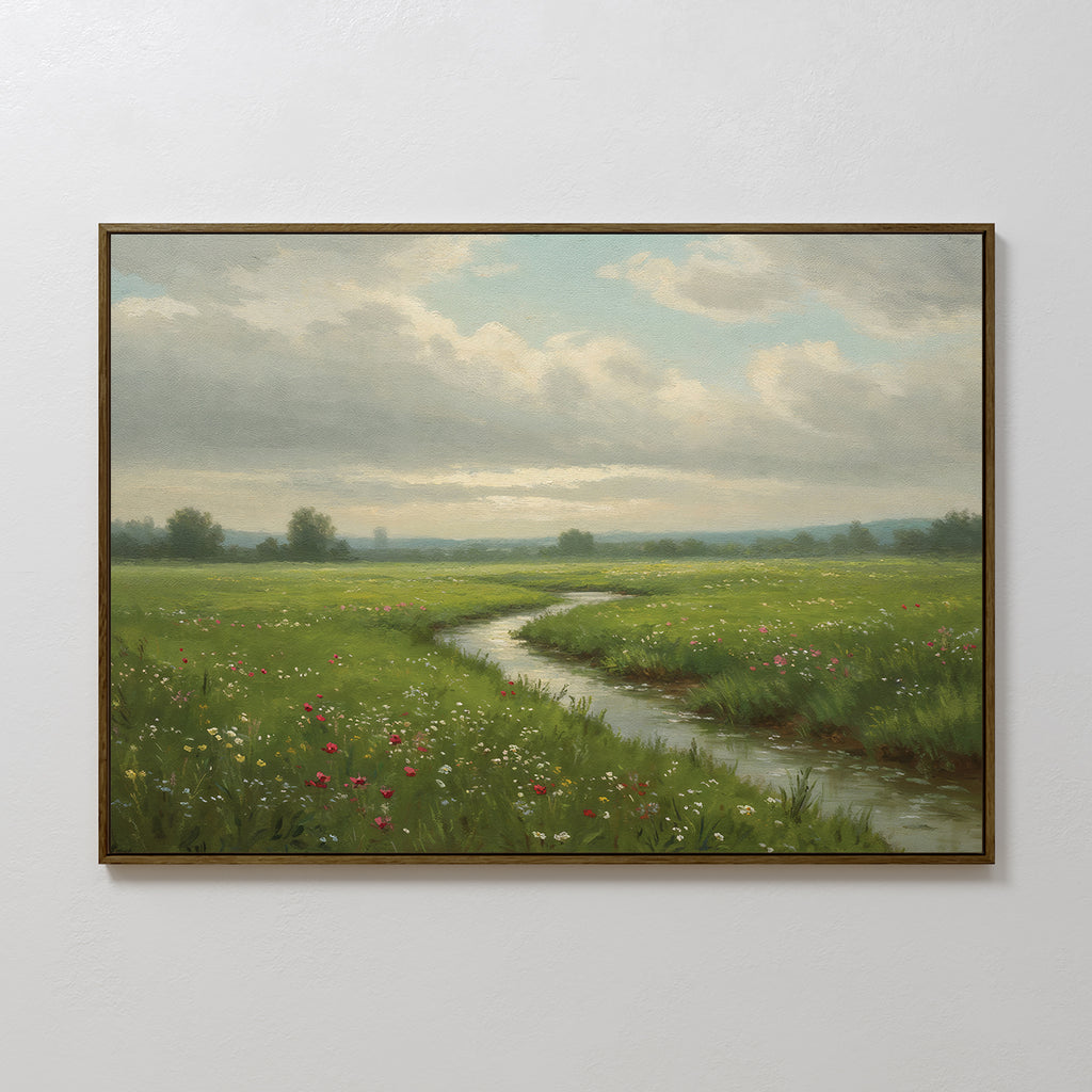 The Winding Stream Canvas Art features a green meadow with wildflowers, a winding stream, and distant trees beneath a partly cloudy sky, making striking wall art on any plain white wall.