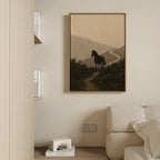 The Winding Trail Canvas Art, showcasing a horse on a misty mountain path, hangs above a light couch in this minimalist living room.