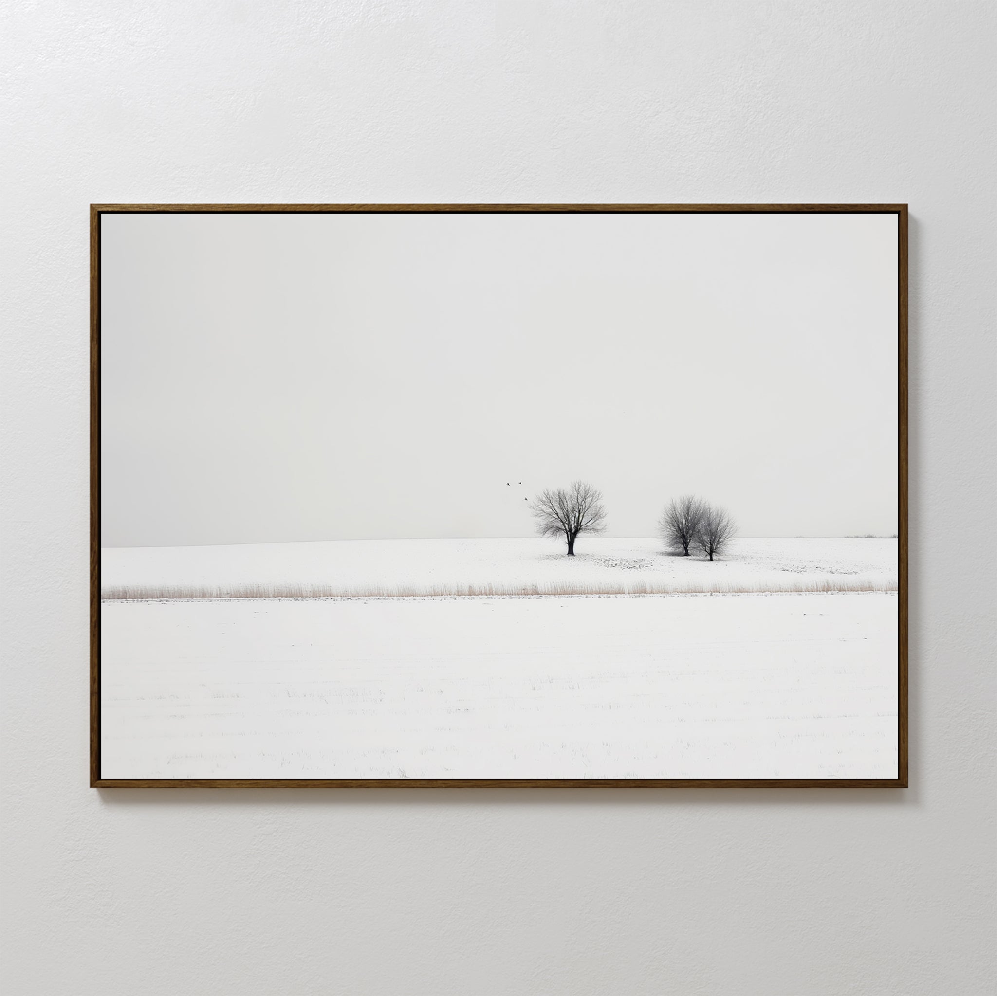 Winter Silence Canvas Art features a minimalist photograph of two bare trees in a snowy landscape beneath a pale sky—an elegant choice for winter wall decor.