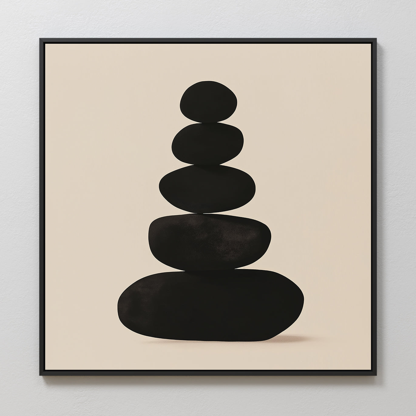 Zen Balance Canvas Art showcases five black stones stacked vertically on a light beige background, framed with a sleek black border—ideal zen wall decor for creating a tranquil living room atmosphere.