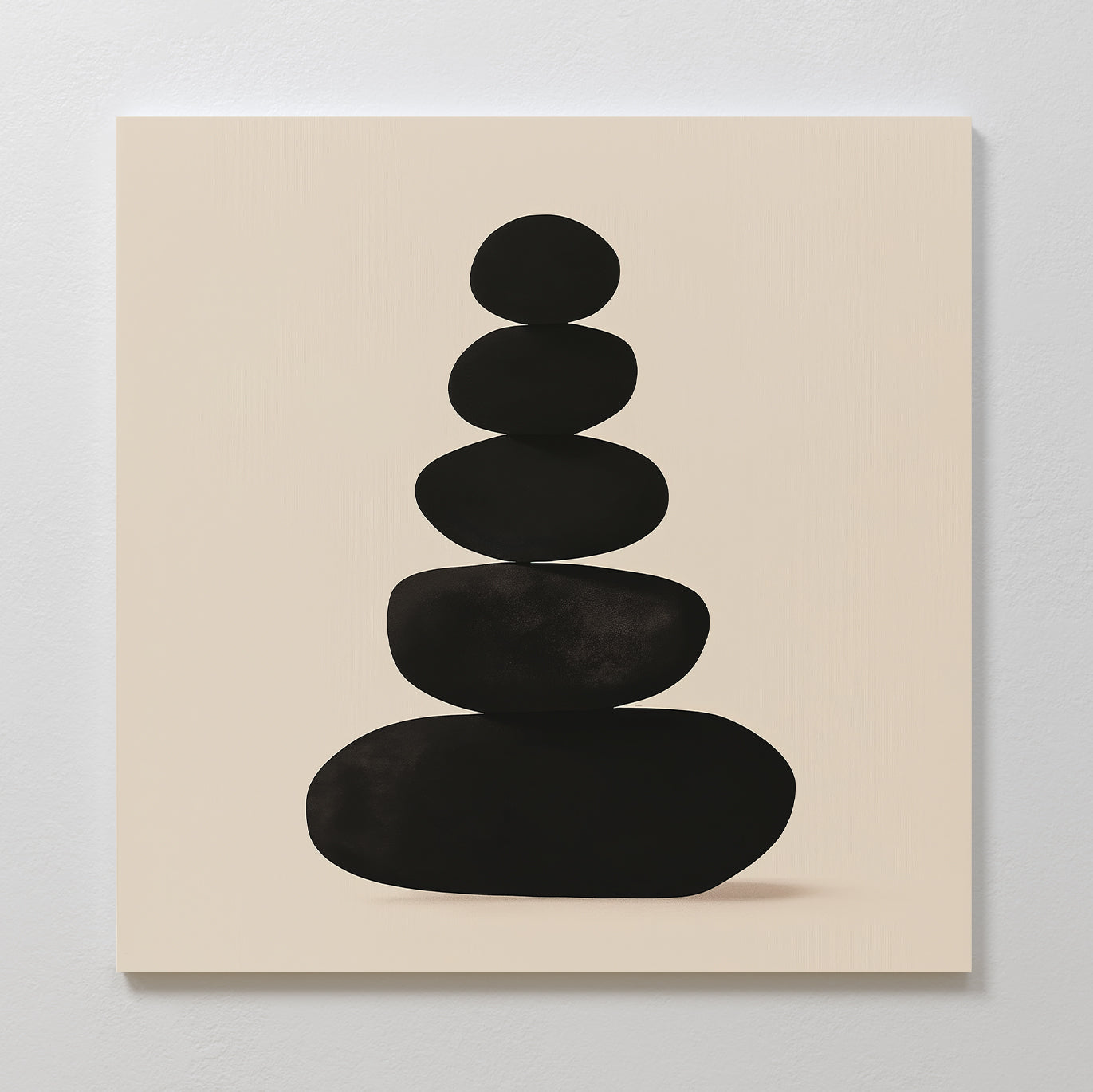 Zen Balance Canvas Art showcases five smooth black oval stones stacked on a light beige background, creating a minimalist and calming wall art piece—ideal for bringing serenity to your living room decor.