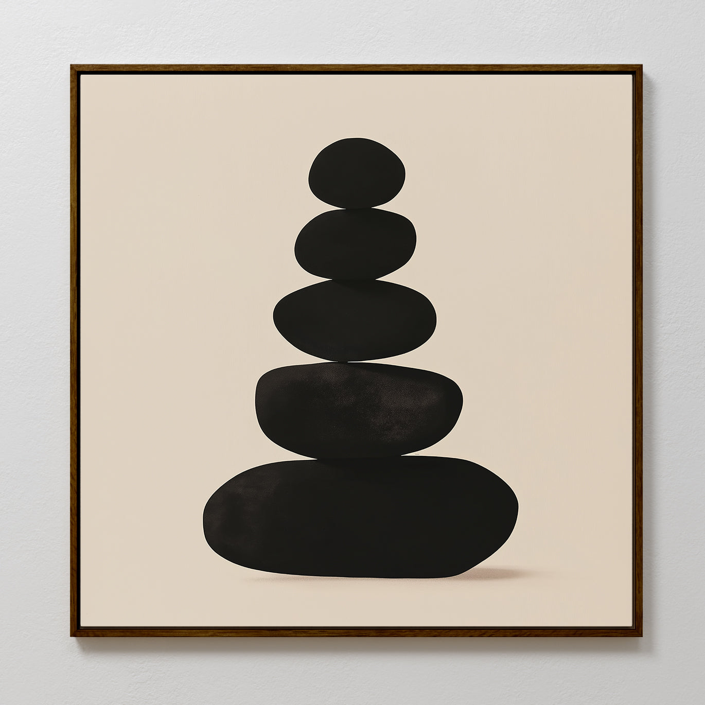 Zen Balance Canvas Art features five smooth black stones stacked on a beige background, framed in thin dark wood. This minimalist print brings balance and simplicity, perfect as calming wall decor for your living room.