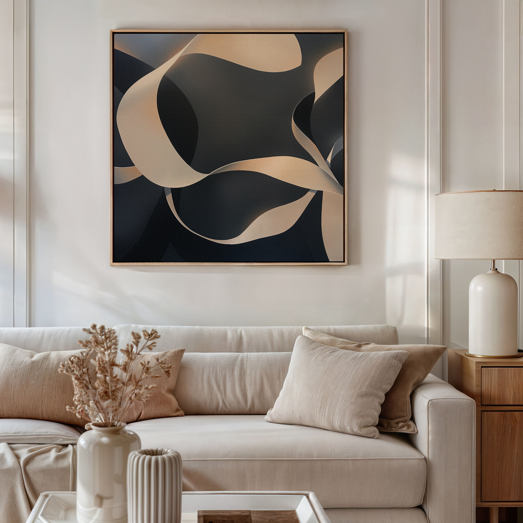 A modern living room with a beige sofa, neutral cushions, a side table with a lamp, dried flowers in a vase, and the Quiet Division Abstract Canvas Art featuring flowing shapes in black, beige, and cream tones for modern elegance.