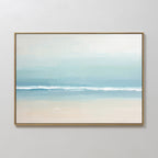 The Airy Shore Canvas Art - Horizontal captures a minimalist seascape in soft blue and white tones, with gentle waves, a sandy beach, and a pale sky evoking a calm coastal atmosphere.
