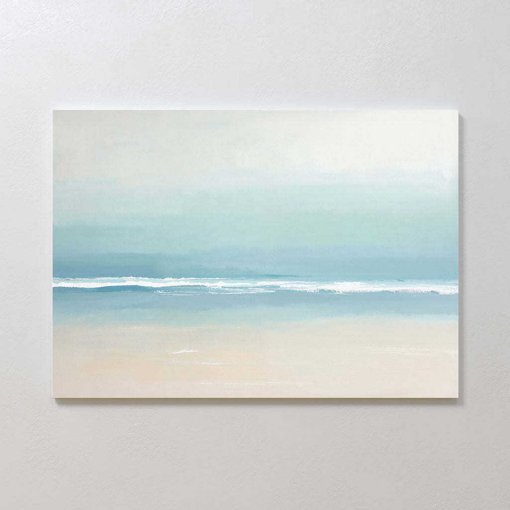 The Airy Shore Canvas Art - Horizontal showcases a minimalist beach scene in soft blues, white, and beige, with gentle waves meeting the sand—perfect for Nordic Park wall art to create a tranquil seaside vibe.