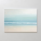 The Airy Shore Canvas Art - Horizontal showcases a minimalist beach scene in soft blues, white, and beige, with gentle waves meeting the sand—perfect for Nordic Park wall art to create a tranquil seaside vibe.