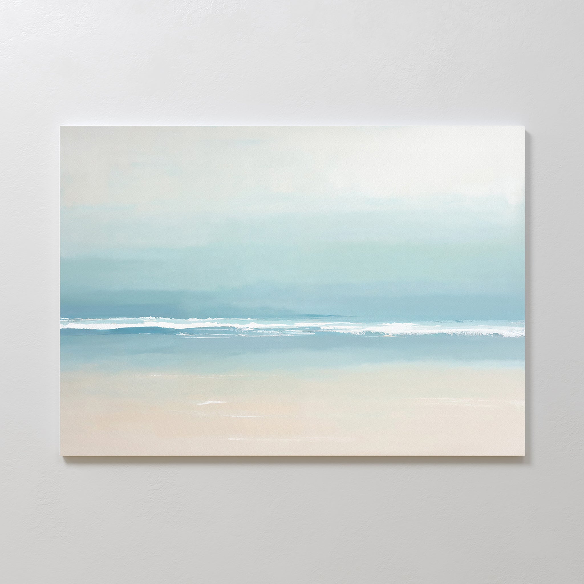 The Airy Shore Canvas Art - Horizontal showcases a minimalist beach scene in soft blues, white, and beige, with gentle waves meeting the sand—perfect for Nordic Park wall art to create a tranquil seaside vibe.
