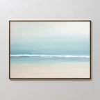 Airy Shore Canvas Art - Horizontal features a minimalist coastal scene with pastel hues, soft sand, a tranquil blue ocean, and a hazy sky. This framed piece brings serene seaside vibes to any plain white wall.