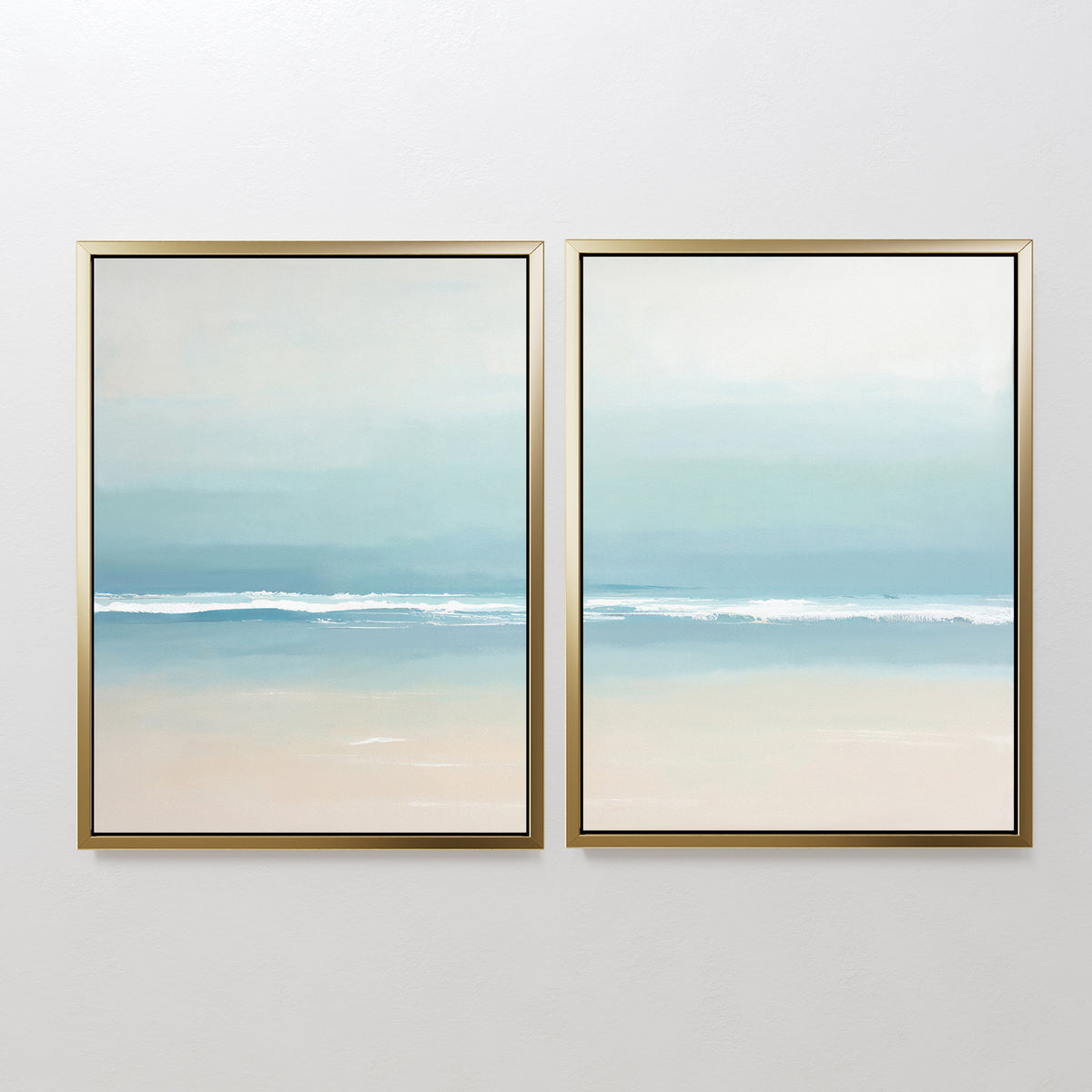 The "Airy Shore - Set Of 2" features framed paintings of a serene beach with gentle waves and a soft blue sky in pastel tones, creating calming coastal wall art that adds a tranquil touch to your home decor.