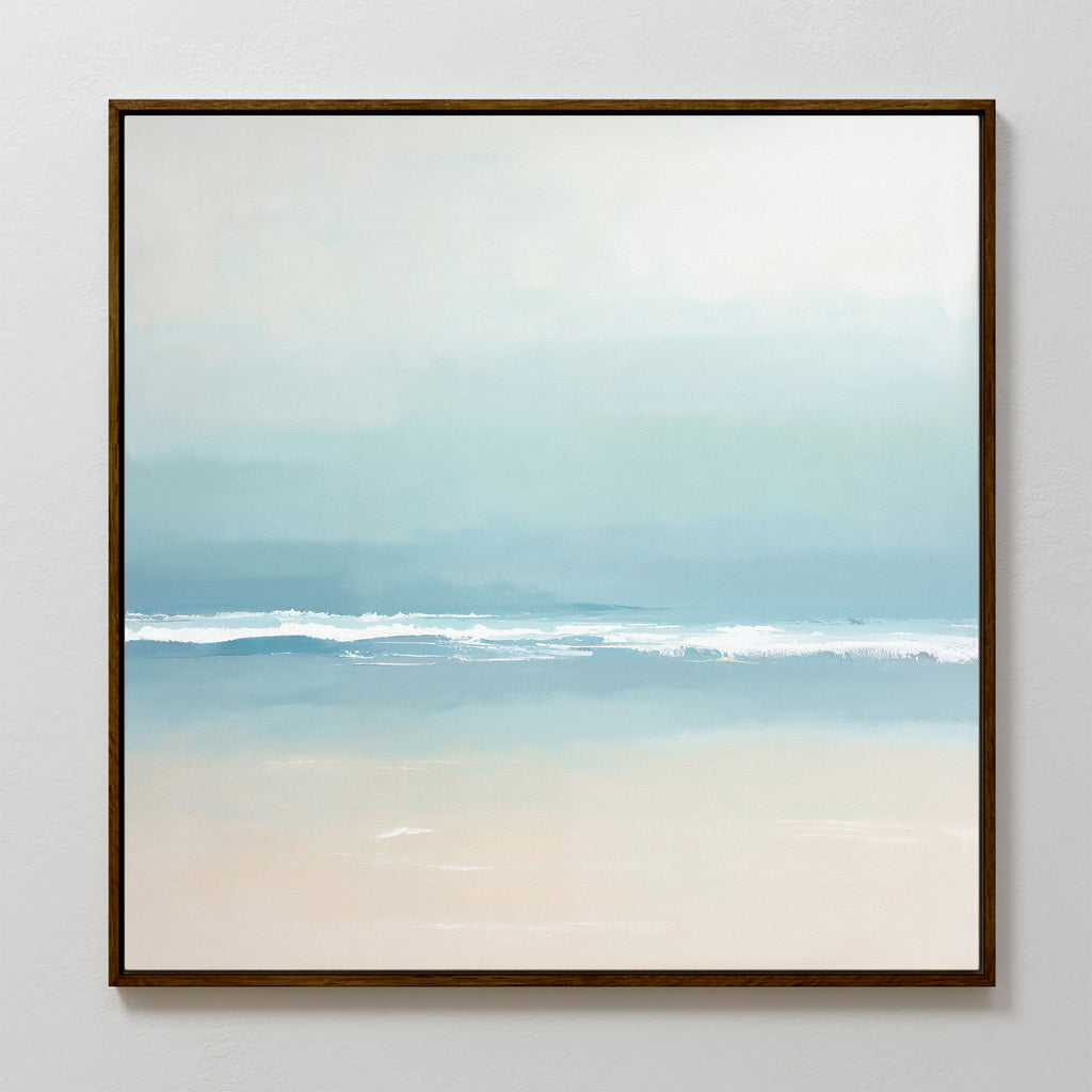 The Airy Shore Canvas Art - Square features a minimalist Nordic design with soft blue and white tones, gentle waves, and a sandy shore under a hazy sky—perfect for creating serene seaside decor.