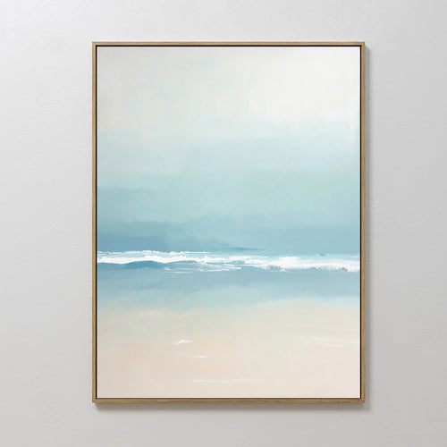 The Airy Shore Canvas Art - Vertical showcases a serene beach scene with soft pastels, featuring gentle waves on sandy shores under a light blue sky, perfect for adding a peaceful coastal touch to your space.