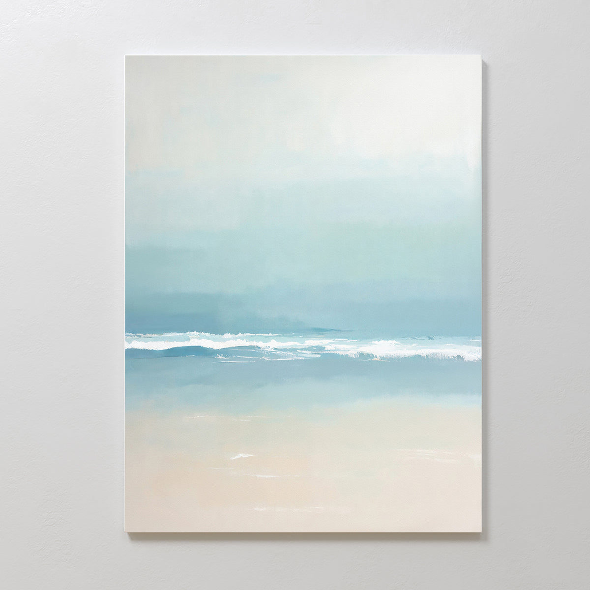 The Airy Shore Canvas Art - Vertical features a minimalist coastal print with gentle waves, soft blue and teal water, and light beige sand and sky for a serene seaside atmosphere.