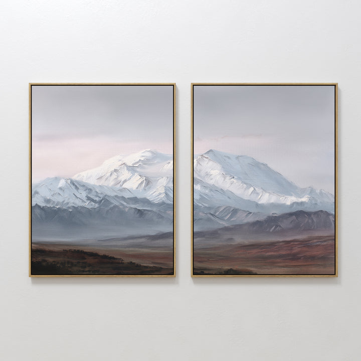 The "Alpine Majesty - Set of 2" features framed wall art of snowy mountain peaks under a pale sky, with brown and green plains below, creating a serene Nordic Park-inspired landscape.