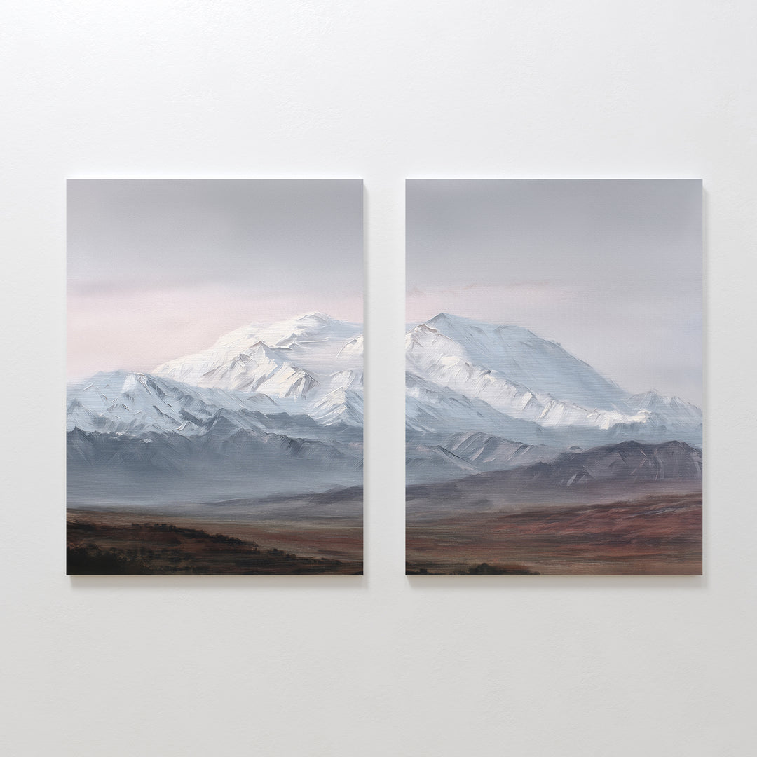Alpine Majesty - Set of 2 showcases side-by-side mountain canvas prints with snow-capped peaks, a cloudy sky, and earthy plains. This Nordic Park-inspired wall art features serene, muted tones for a calming decor accent.