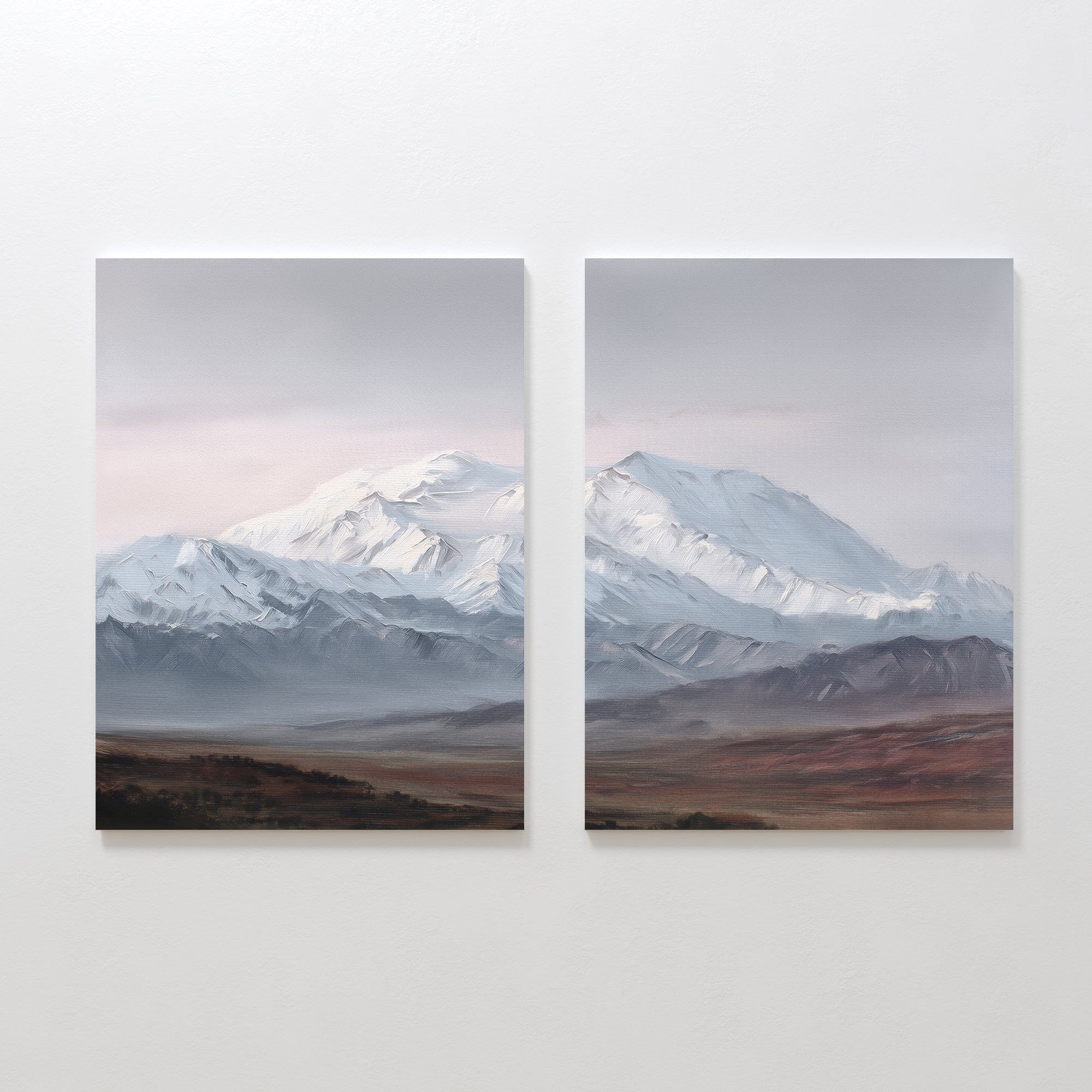 Alpine Majesty - Set of 2 showcases side-by-side mountain canvas prints with snow-capped peaks, a cloudy sky, and earthy plains. This Nordic Park-inspired wall art features serene, muted tones for a calming decor accent.